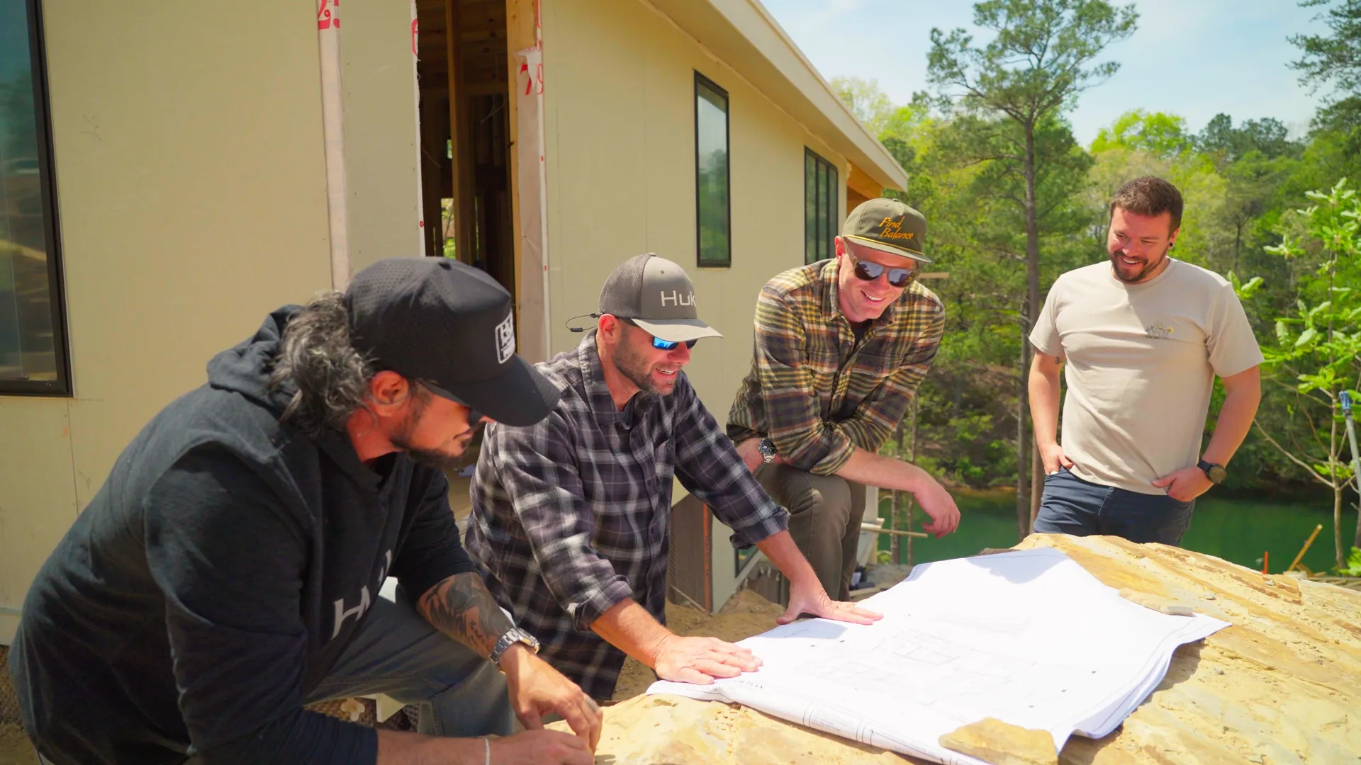 Sweet Homes — the four friends over the plans